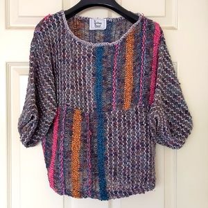 NWOT. Woman's Multi color half length big sleeve crochet sweater.